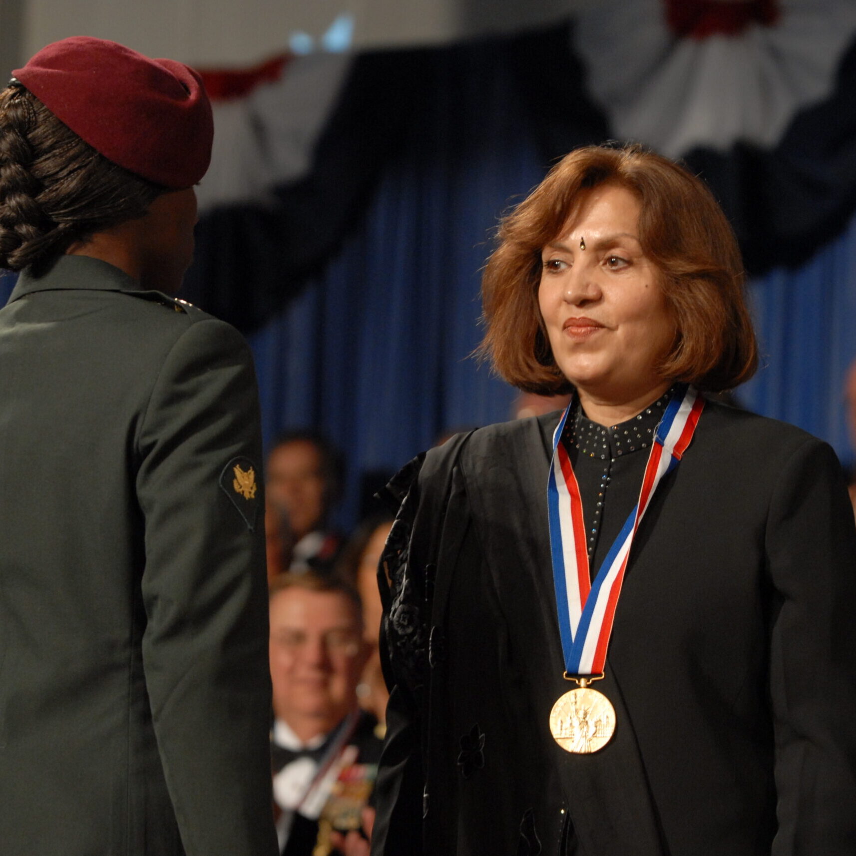 1 - Pam Kwatra Receiving Her Ellis Island Award